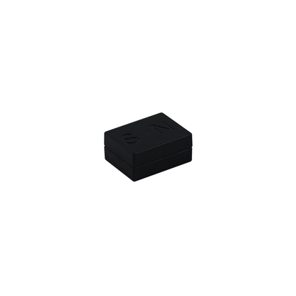 A small, rectangular black box with a matte finish featuring the raised letters "S" and "N" on the lid. This sleek design, from E-Blox's Circuit Blox™ 59 project Classroom Set - E-Blox® Circuit Board Building Blocks Educational Sets, often accompanies STEM education kits that meet NGSS requirements. The plain white background makes the box the central focus of the image.