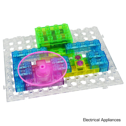 A vibrant Circuit Blox™ 120 Project Classroom Set from E-Blox, featuring transparent plastic pieces in shades of green, blue, and pink, arranged on a clear base grid. The components include a pink circular piece and various rectangular blocks. The text "Electrical Appliances" is displayed in the bottom right corner, making it an ideal choice for any STEM program.