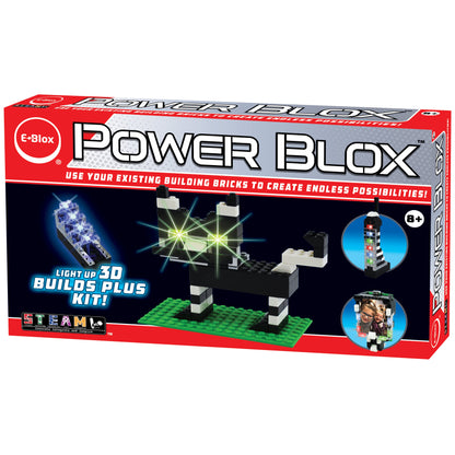 The image showcases the packaging for the "Power Blox™ Builds Plus Set - E-Blox® - LED Light-Up Building Blocks Student Set." The box, predominantly red and white, features images of a light-up 3D dog model, a vertical structure, and two children engaged with the kit. Suitable for ages 8 and up, it aligns with STEM curriculum standards.