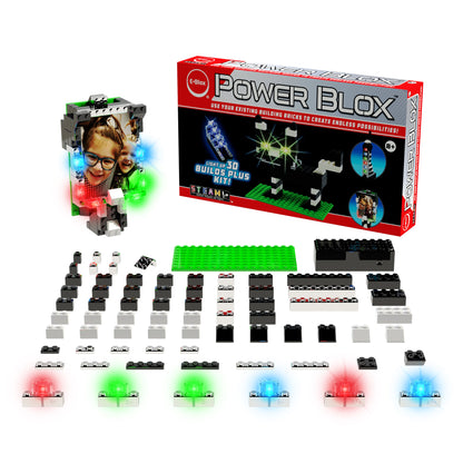 The Power Blox™ Builds Plus Set - E-Blox® - LED Light-Up Building Blocks Student Set is showcased, featuring an assortment of building blocks, LED lights, and electronic components meticulously arranged. The packaging displays an image of a child alongside an illuminated robot and promotional text highlighting the endless possibilities for 3D builds. This versatile kit aligns perfectly with STEM curriculum standards.