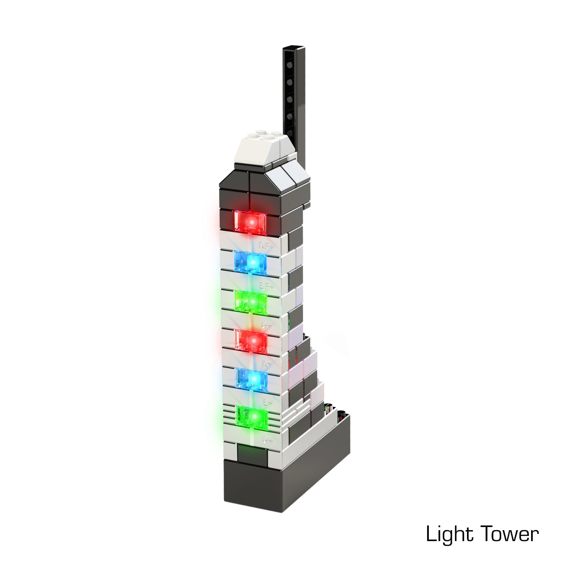 The Power Blox™ Builds Plus Set - E-Blox® from E-Blox features an LED light-up tower model with multiple rectangular colored lights, including red, blue, and green, on its sides. The base is black, constructed using Power Blox bricks, while the rest of the structure incorporates white, black, and gray pieces. "Light Tower" is labeled at the bottom right corner and aligns with STEM curriculum concepts.