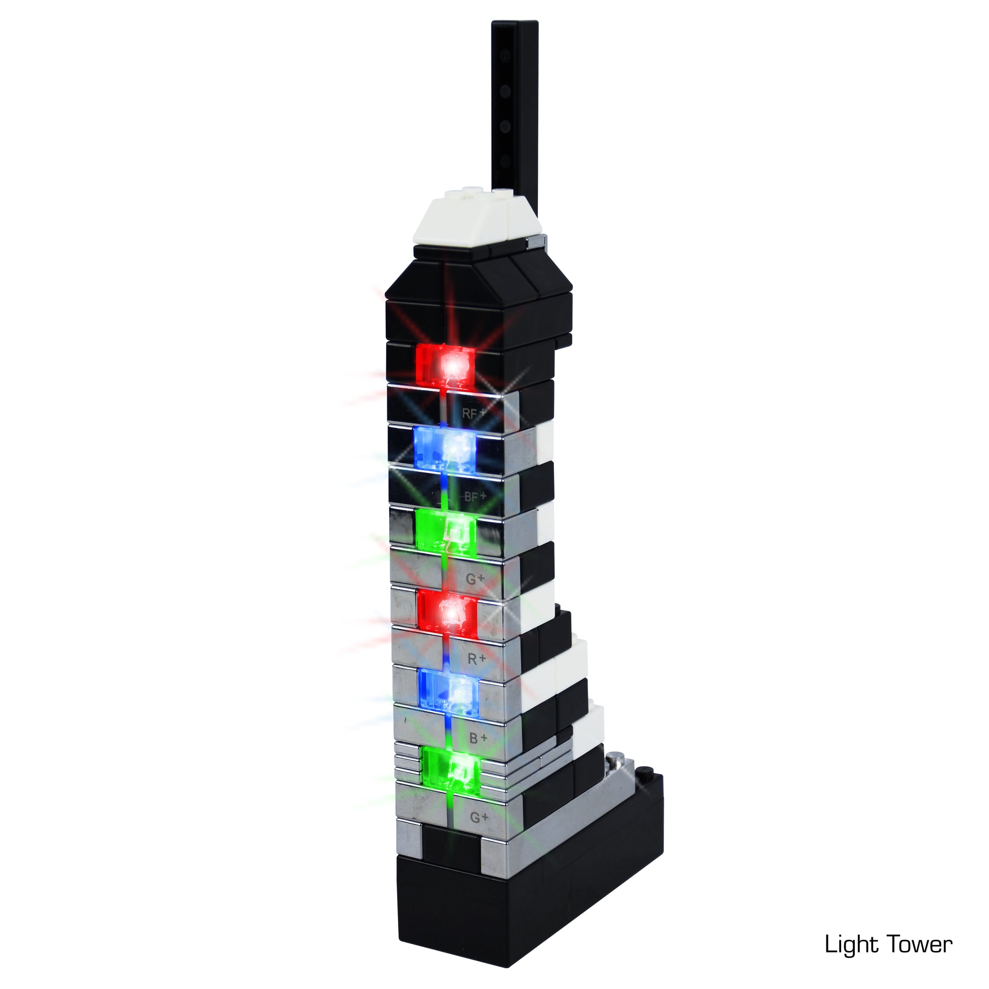 A tall model built from E-Blox bricks, featuring a vertical array of colored LEDs. The structure includes black, white, and translucent bricks arranged in a stepped pattern. The LEDs emit red, green, and blue light. Designed to meet NGSS requirements, the text in the lower right corner reads "Power Blox™ Builder 292 Classroom Set - LED Light-Up Building Blocks.