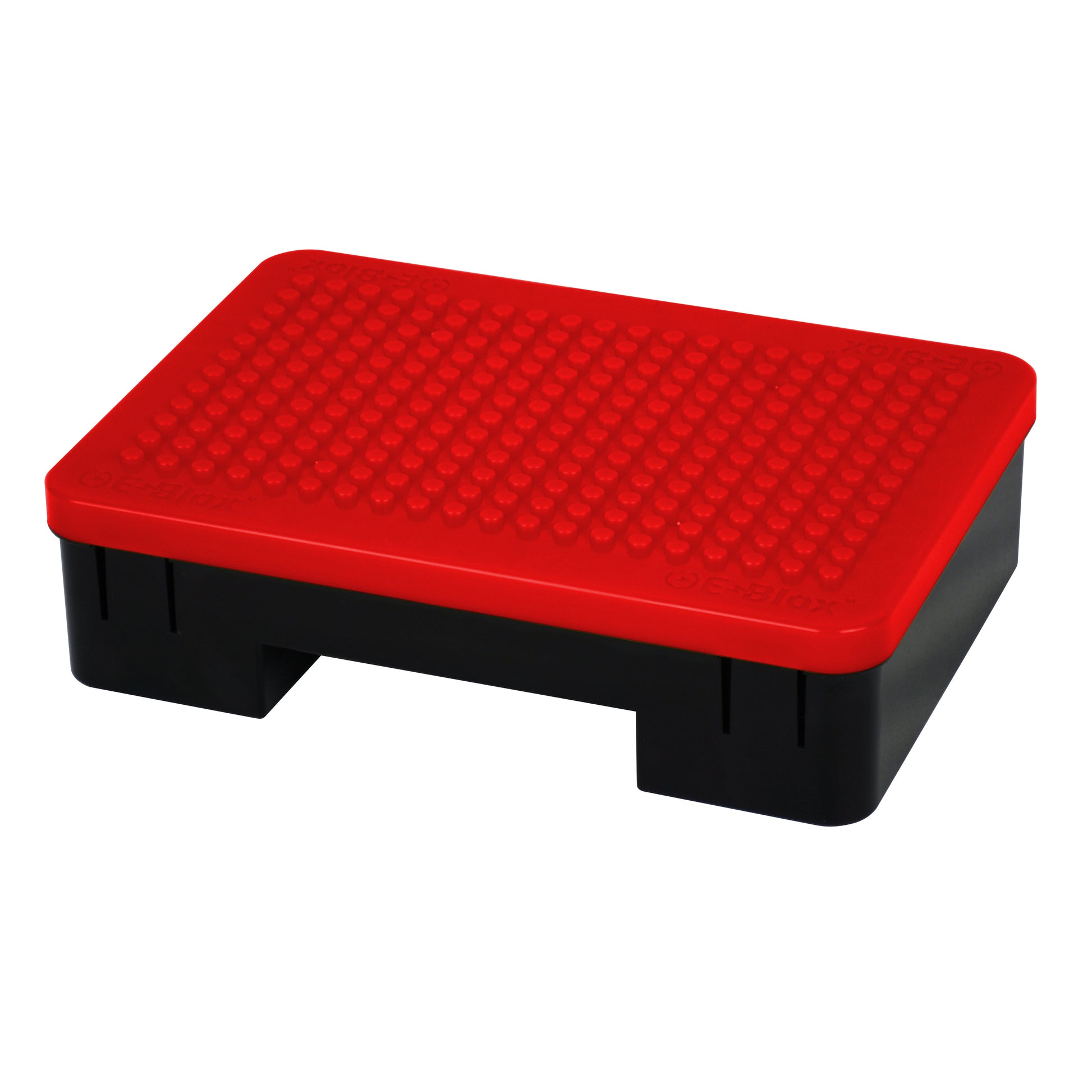 Introducing the Power Blox™ Standard Set - E-Blox® Student Set by E-Blox. This black step stool features a bright red, textured surface on top. With a sturdy build and rectangular shape, it stands at approximately one foot tall. Using patented technology, the raised dot pattern on the textured surface provides added grip for enhanced safety.