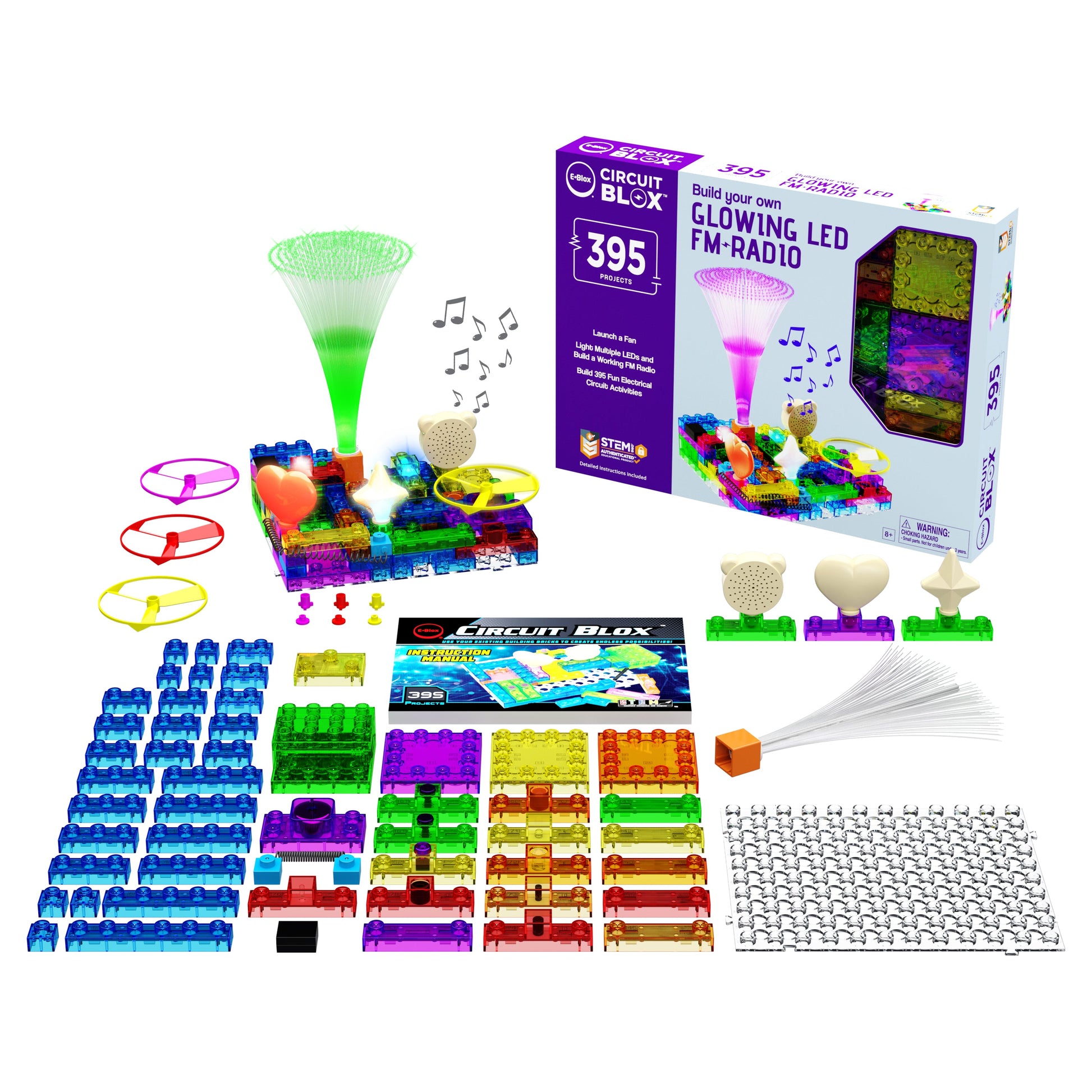 Image of a Circuit Blox™ 395 Project Classroom Set by E-Blox® with glowing LED FM radio functionality and 395 engaging projects. The kit features colorful interlocking blocks, various electronic components, a base grid, an instruction booklet adhering to NGSS requirements, and completed project examples. The background showcases the box packaging.