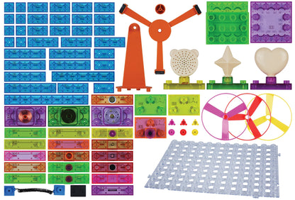 A variety of colorful plastic construction parts are neatly arranged on a white background. The parts include blue, green, red, and purple connectors, propellers with blades, gears, and other small components. There is also a large gray grid piece at the bottom—a perfect set for any STEM curriculum or Circuit Blox™ 800 Classroom Set from E-Blox® Circuit Board Building Blocks Toys for Kids.
