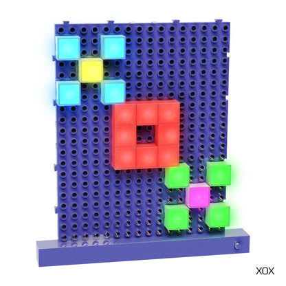 The Lite Blox Classroom Set by E-Blox features a vertical blue pegboard adorned with a vibrant array of illuminated LED Blox. At the center is a red square composed of four cubes, encircled by smaller clusters of yellow, blue, green, and pink cubes. In the bottom right corner, "XOX" is written in black text to inspire creativity.