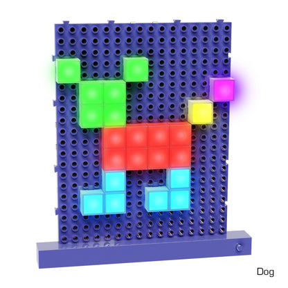 A blue pegboard with illuminated, colorful square blocks arranged in the shape of a dog using the Lite Blox Classroom Set - E-Blox® Building Blocks from E-Blox. The blocks are lit in green for the head, red for the body, and blue for the legs. A yellow and a purple block are also part of the design. The word "Dog" is labeled at the bottom right to stimulate creativity.