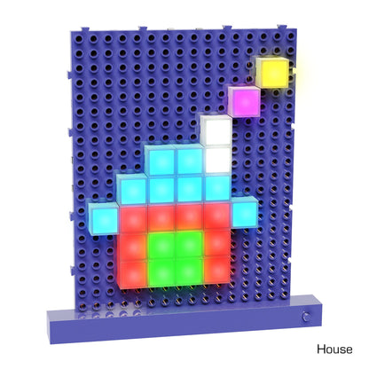 A colorful arrangement of Lite Blox from the E-Blox Classroom Set forms a house-like shape on a perforated blue grid. The cube colors stimulate creativity with reds, greens, blues, whites, yellows, and purples. A small yellow cube and a larger white one at the top symbolize a floating structure.