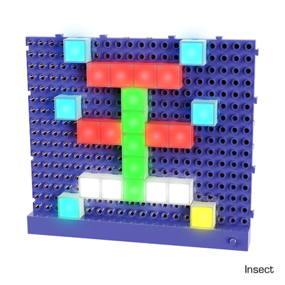 A grid-based board with colored LED pegs, featured in the E-Blox Lite Blox Classroom Set, forms a pixel art image of an insect. The insect's body, wings, legs, and eyes are depicted using red, green, blue, and white lights against a purple background. The word "Insect" is displayed in the bottom right corner.