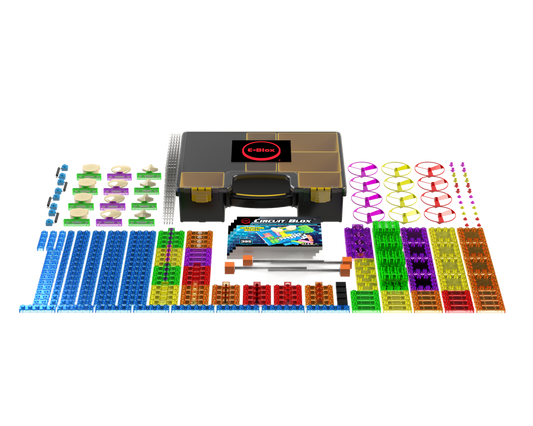 The Circuit Blox™ 395 Project Classroom Set from E-Blox features a neatly arranged collection of brightly colored building components, including blue, green, red, purple, and orange pieces. These elements are distributed around a central box labeled "Circuit Blox." The set includes blocks, connectors, and other electronic components that adhere to NGSS requirements.