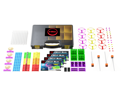 The Circuit Blox™ 59 Project Classroom Set by E-Blox is displayed, featuring a black carrying case, colorful wire coils, various connectors, switch modules, LED lights, several circuit boards, and instructional manuals for Circuit Blox projects—perfect for enhancing STEM education and meeting NGSS requirements.