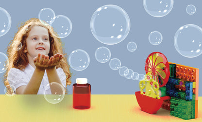 product blowing bubbles with girl catching and solution bottle on table.