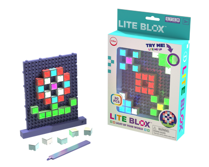 A Lite Blox - Light up your world! toy set from E-Blox, Inc., included with 30 pieces, is displayed. The set features colorful, translucent blocks arranged on a pegboard, creating pixelated light pictures. The box shows a sample flower design and promotes its STEM benefits, including an interactive "try me" feature.