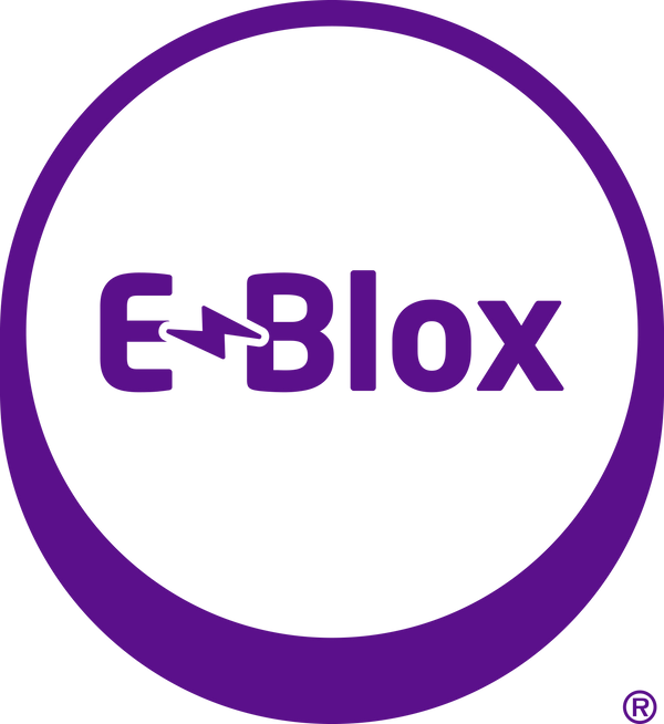 A purple circular logo with a thick outer border and the word "E-Blox" inside. The letter "E" is styled with a lightning bolt forming part of the horizontal line. The bottom right of the circle shows a small trademark symbol.