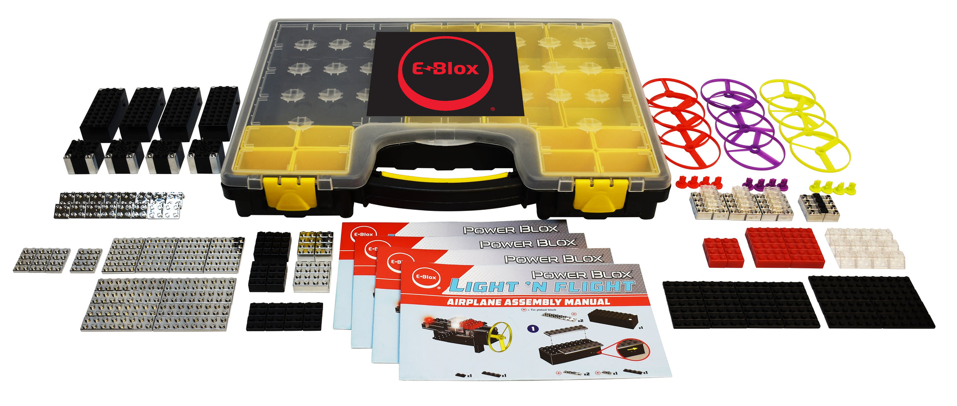 The E-Blox Power Blox™ Light 'N Flight 5-in-1 Classroom Set is spread out, showcasing assorted blocks and components, a yellow-handled carrying case, and numerous colorful circular parts. Four instruction manuals titled "Power Blox: Light 'N Flight Airplane Assembly Manual" are also included. Designed to align with the STEM curriculum, this set makes a great addition to enhance LEGO sets.