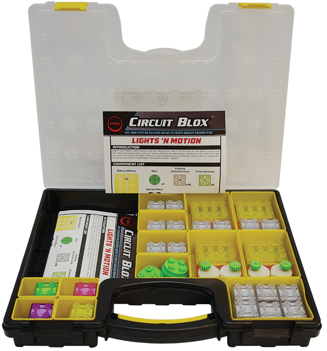 The Circuit Blox™ Lights 'n Motion- Classroom Set by E-Blox comes in an open plastic case. The case is divided into yellow compartments that hold a variety of electronic components, such as switches, LED blocks, and connectors. Instruction manuals are visible in the lid and center section of the case, making it ideal for educational play within a STEM curriculum.