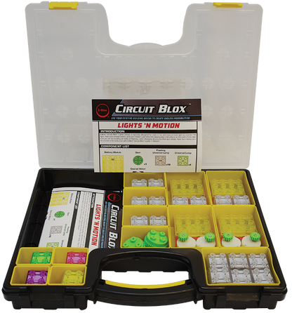 The Circuit Blox™ Lights 'n Motion- Classroom Set by E-Blox comes in an open plastic case. The case is divided into yellow compartments that hold a variety of electronic components, such as switches, LED blocks, and connectors. Instruction manuals are visible in the lid and center section of the case, making it ideal for educational play within a STEM curriculum.