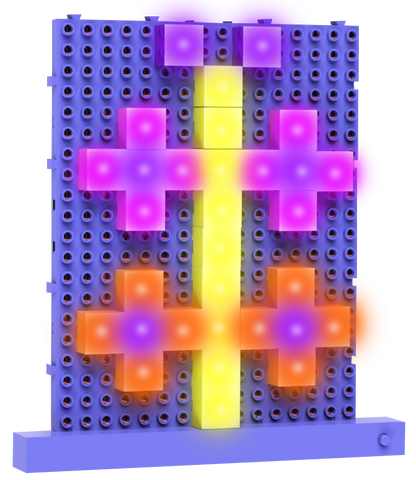 The Lite Blox 2 by E-Blox, Inc. is a rectangular pegboard featuring colorful illuminated pegs arranged in a striking pattern. In the center, a vertical yellow line intersects with horizontal lines forming crosses: pink crosses are displayed at the top and bottom, while an orange cross illuminates the middle, creating vibrant light-up pictures with this new and exciting LED toy.