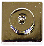 Close-up of the Circuit Blox™ - 1 Wire Block Tin - E-Blox® with a circular design on a square plate, resembling the intricate details found in E-Blox products. The surface appears shiny and reflective, with some minor scratches visible.