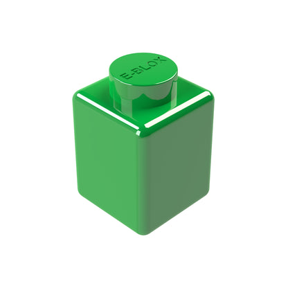 A glossy green 1x1 E-Blox block features a round peg on top, etched with "E-BLOX," and showcases smooth surfaces and sharp edges against a plain white background. This conductive marvel is versatile, available in 7 different colors.