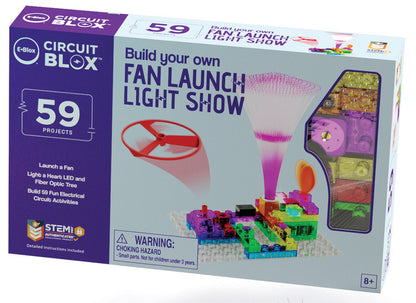 An image of the Circuit Blox™ 59 - E-Blox® Circuit Board Building Blocks Toys. The box displays a vibrant electronic circuit arrangement featuring a flying fan, LED lights, and a fiber optic tree. Text on the box states, "Build your own Fan Launch Light Show," "59 Projects," and "For Ages 8+." This kit is ideal for introducing kids to electricity through engaging building projects.