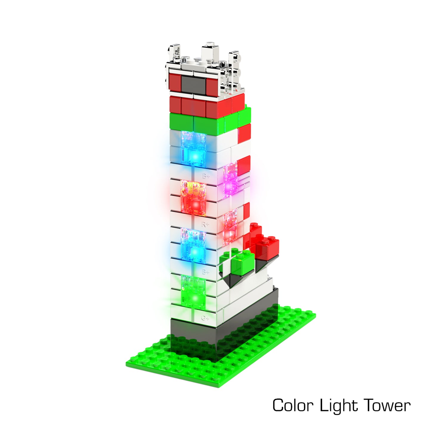 A vibrant tower constructed with interlocking bricks stands on a green base. The Power Blox™ Builds Deluxe Set - E-Blox® LED Light-Up Building Blocks features horizontal stripes in red, white, and green, with illuminated blocks in blue, white, and red near the middle. This set is perfect for sparking creativity and enhancing any STEAM curriculum. The text "Color Light Tower" is written in the bottom right corner.