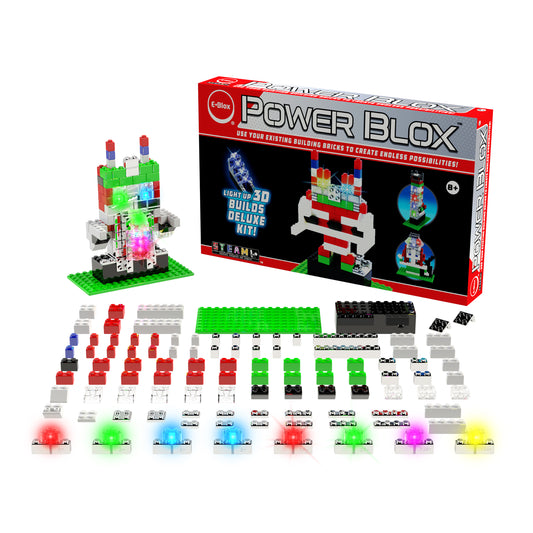 The "Power Blox™ Builds Deluxe Set - E-Blox® LED Light-Up Building Blocks" by E-Blox is on display. This educational set includes an array of colorful building blocks, LED lights, and connectors that are neatly arranged. The box features an example model that highlights circuitry designed to inspire creativity and facilitate the construction of 3D structures within the STEAM curriculum.