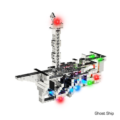 A digital render of a futuristic, blocky spaceship with a tall central tower and various colored lights. The ship is composed of open structures and intricate, grid-like designs reminiscent of the E-Blox Power Blox™ Pro Set - LED Light-Up Building Blocks, with the text "Ghost Ship" in the bottom right corner.