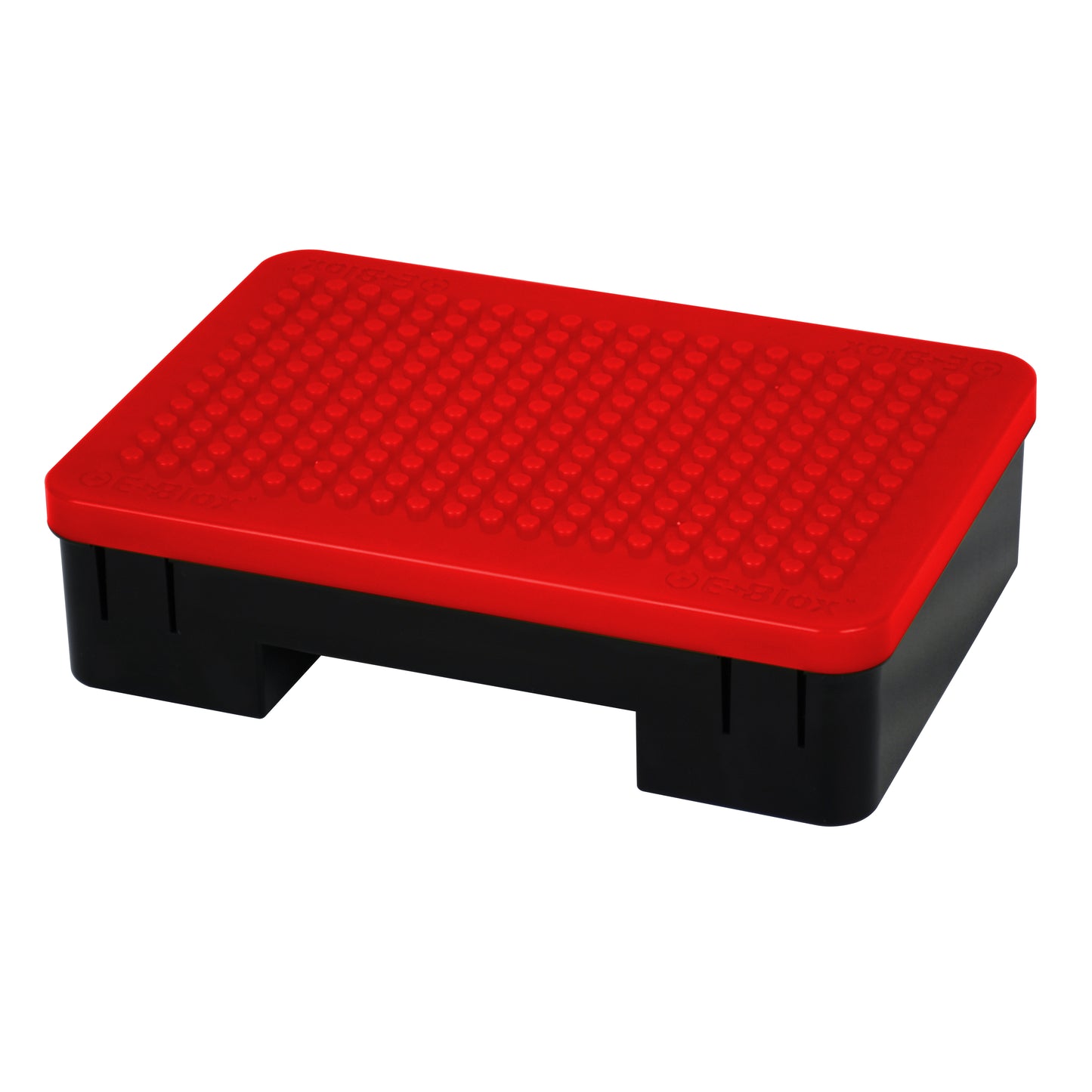 The Power Blox™ LED add-on set by E-Blox® is a sturdy, rectangular plastic step stool in black and red. It features a textured red surface on top for enhanced grip, making it ideal for reaching high shelves or integrating into your STEAM curriculum. The stool has a solid base with two rectangular cutouts on either side for effortless lifting and transportation.