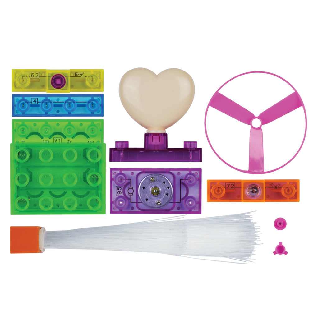 The E-Blox Circuit Blox™ 4 Project Student Set by E-Blox is an educational collection featuring green, blue, yellow, and orange Circuit Blox building blocks. It includes a heart-shaped piece, a pink propeller, a small motor, a bundle of white fiber-optic strands, and various small parts for engaging educational play.