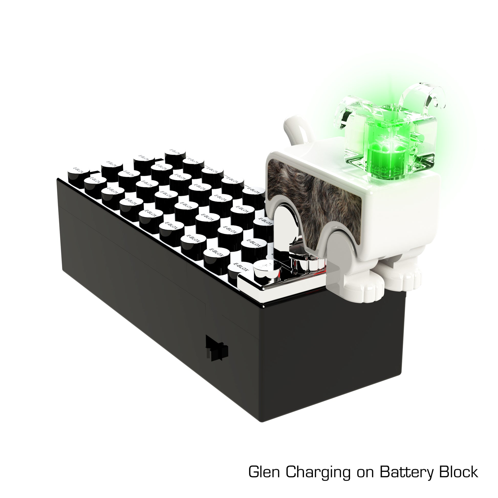 An image of the small LUMEN®- Glen- Illuminated Mini Figure from E-Blox, Inc., positioned on a black battery block. The mini figure has a green light on its head, indicating it's charging. The text "Glen Charging on Battery Block" is displayed in the lower right corner. This is part of the Story Blox™ series.