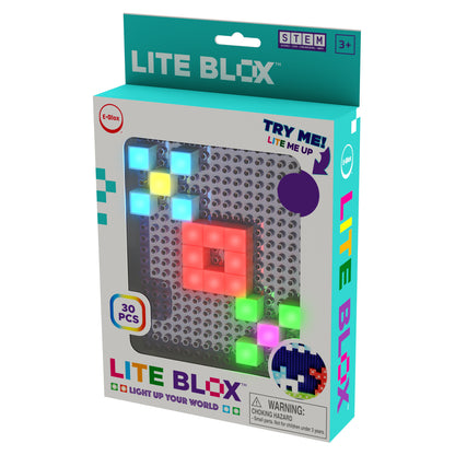 This product box features "Lite Blox - Light up your world!" by E-Blox, Inc., containing 30 pieces. The front displays illuminated colored blocks with a 'Try Me, Lite Me Up' feature, made for children ages 3 and older. As a STEM toy, it includes a warning about choking hazards for children under 3 years. Create light pictures with LED Blox!