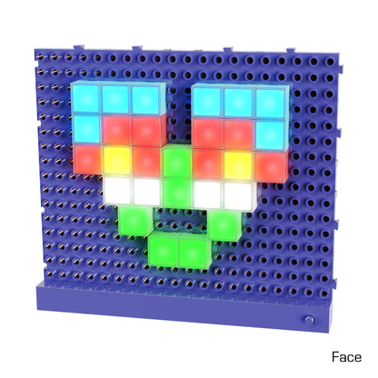 A blue perforated board showcases a face created using Lite Blox - Light up your world! by E-Blox, Inc. The face features blue eyes, a red nose, and a multicolored mouth composed of green, yellow, and white square light blocks. Set against a white background, the board also displays the word "Face" in the bottom right corner.