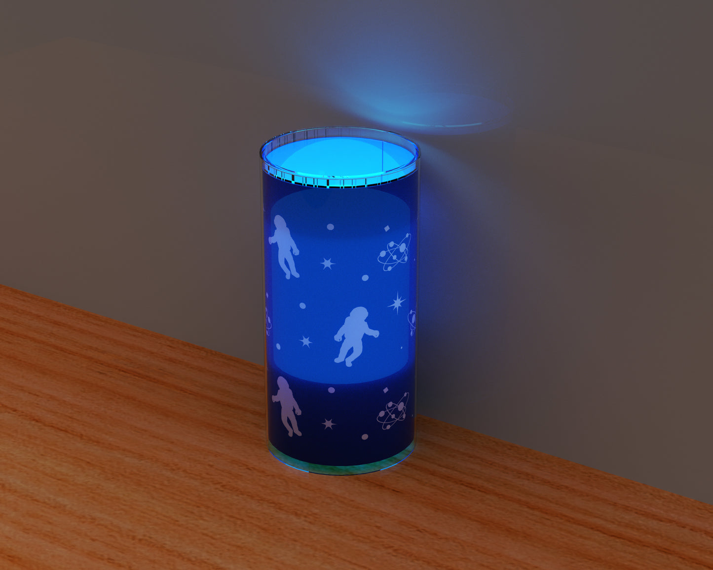 glowing space night light on table 