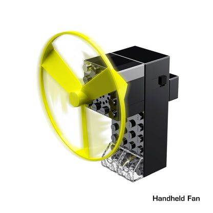 A digitally rendered image of a handheld fan. The fan features a large, translucent yellow blade and a black cylindrical handle with a textured grip and a small button on the side. The term "Power Blox Build Your Own Electric Car and More!" is written in the bottom right corner, along with the brand name "E-Blox.