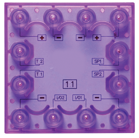 The E-Blox Three-in-One Block for Circuit Builder is a vibrant purple square electrical component equipped with various connectors and informative labels. The top four connectors are labeled with "+". On the left side, you'll find labels "T1" and "T2," while "SP1" and "SP2" are located on the right side. The bottom connectors bear labels "I/O2" and "I/O1.